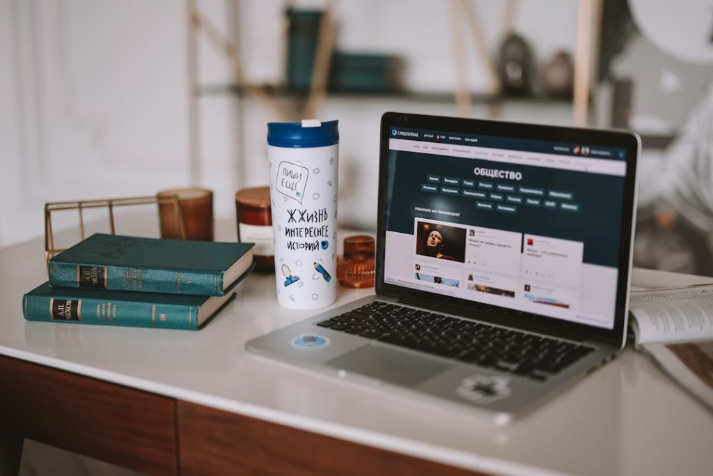 a-laptop-computer-sitting-on-top-of-a-desk-sausmohjida