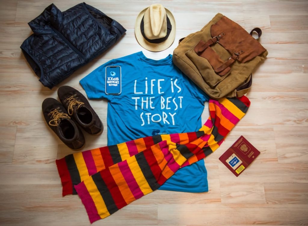a-shirt-that-says-life-is-the-best-story-next-to-a-hat-scarf-zaqlv4psvy8